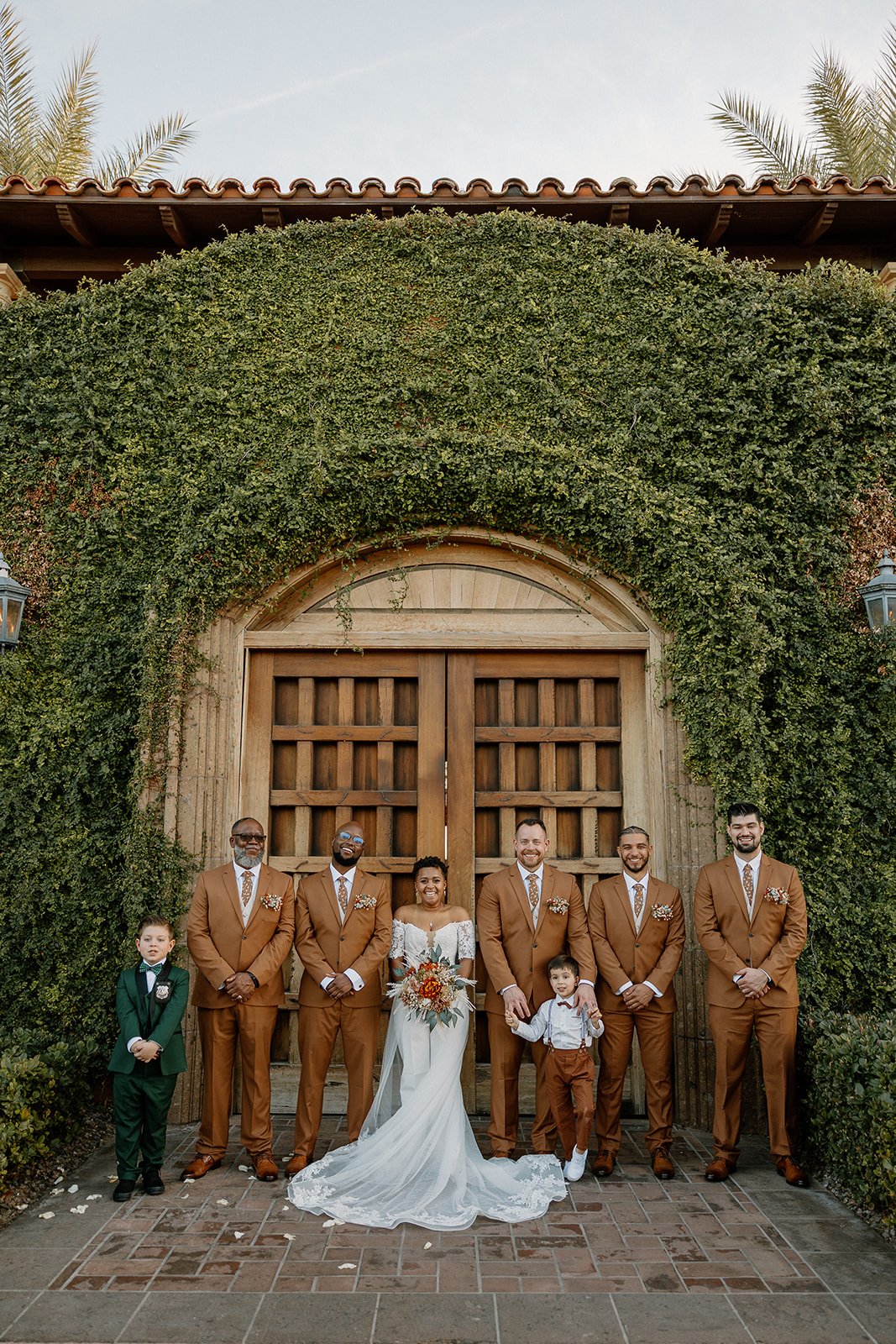 bride poses with their wedding party