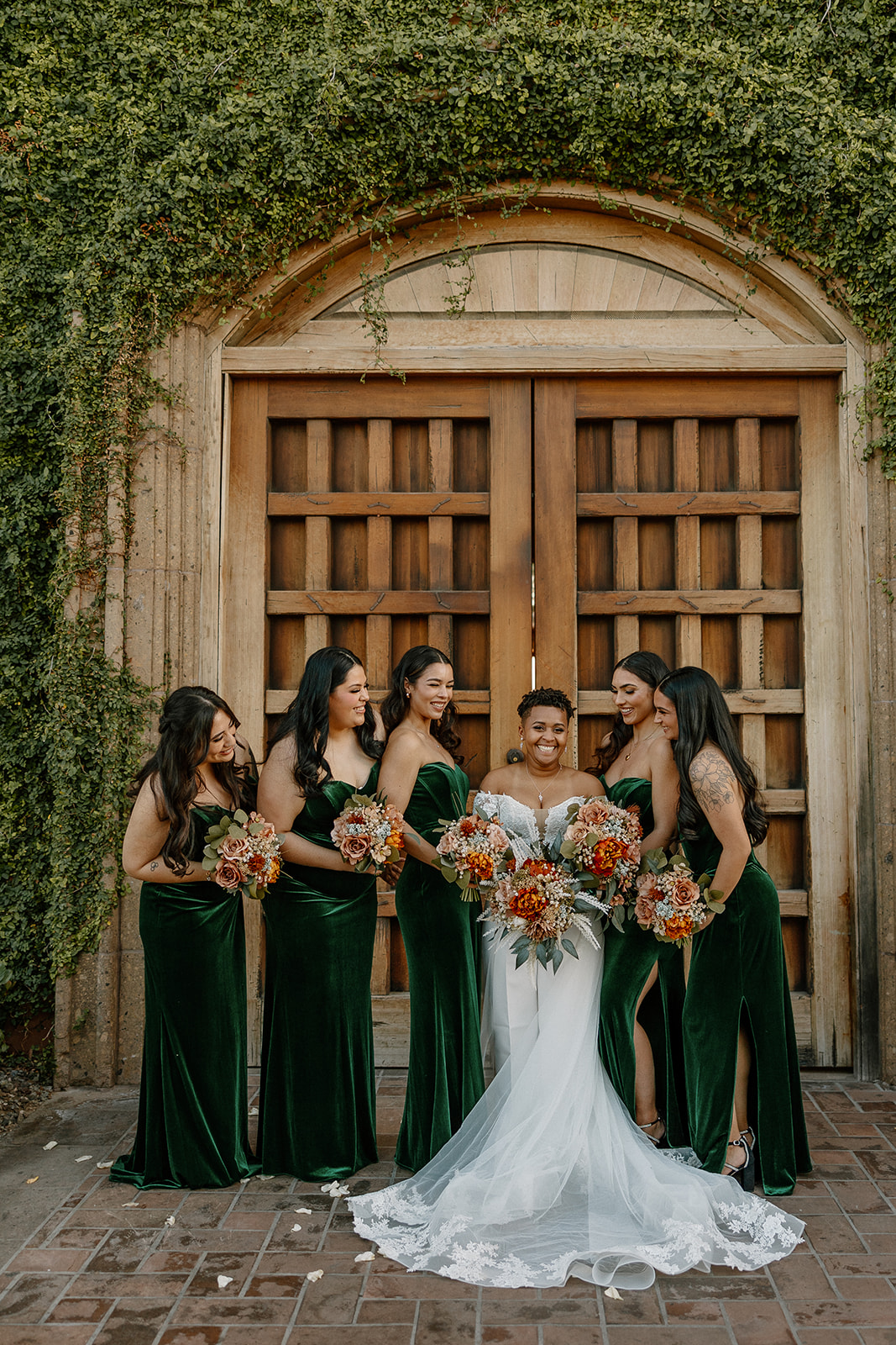 bride poses with their wedding party