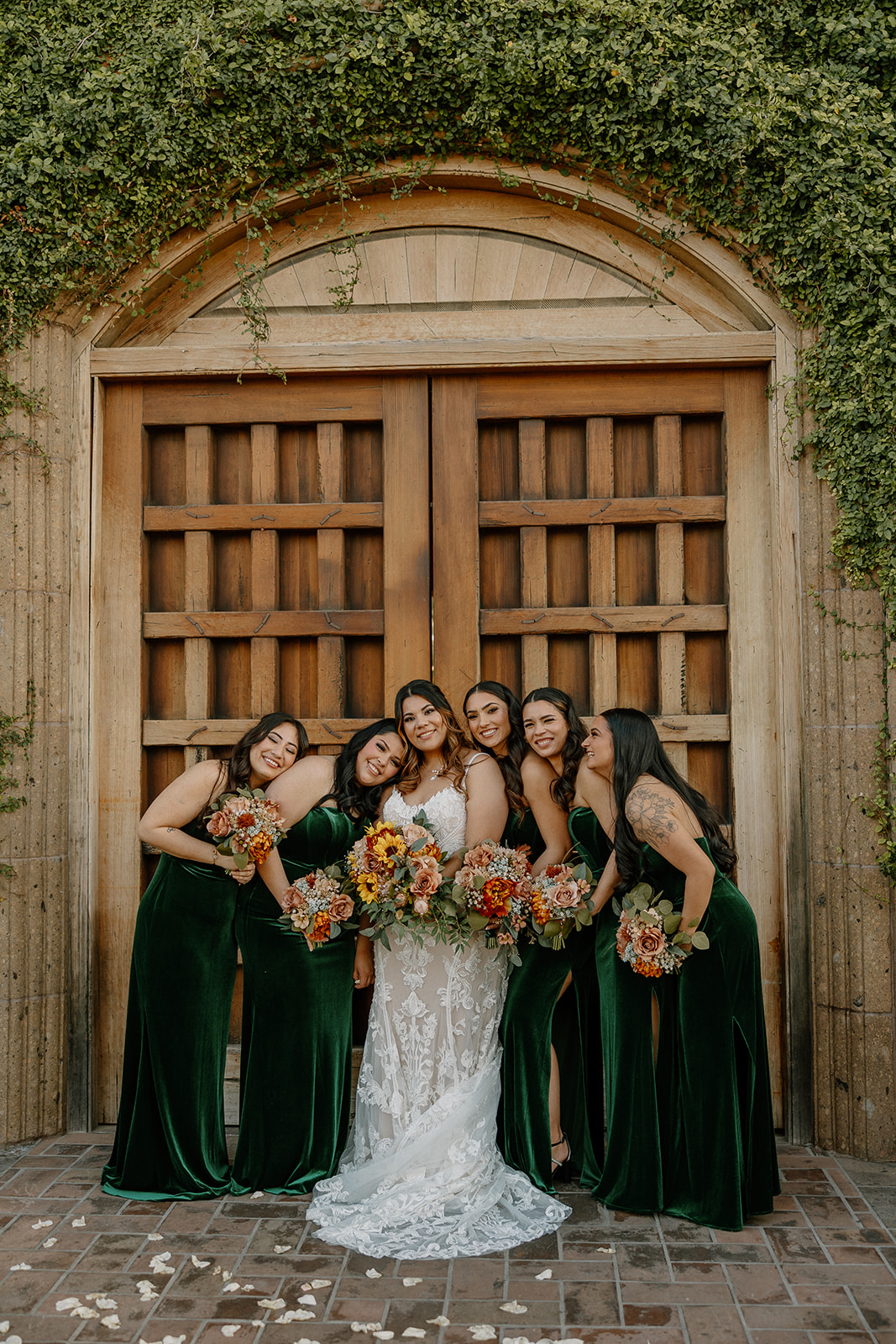 bride poses with their wedding party