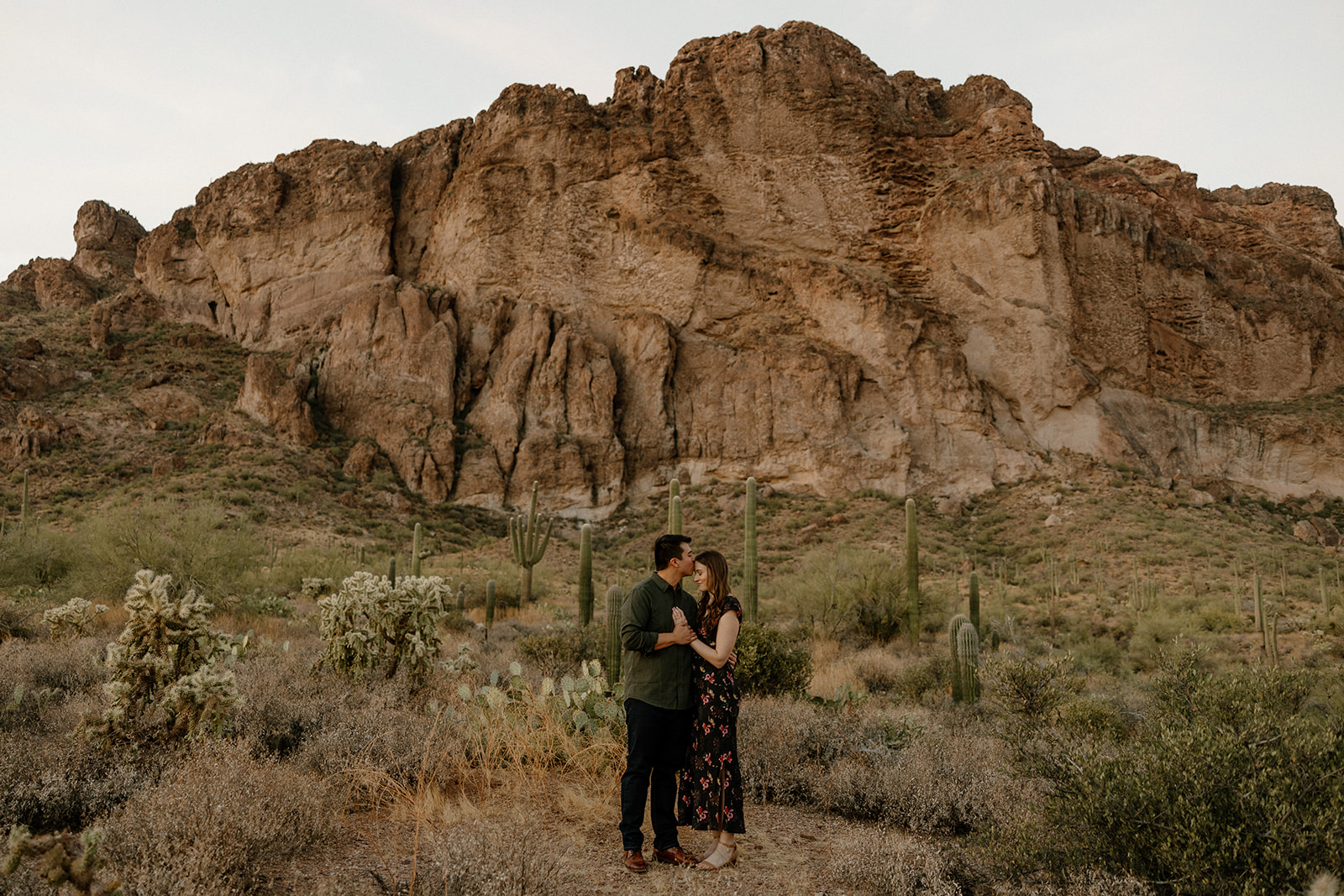 beautiful couple pose in the Arizona desert their engagement photoshoot