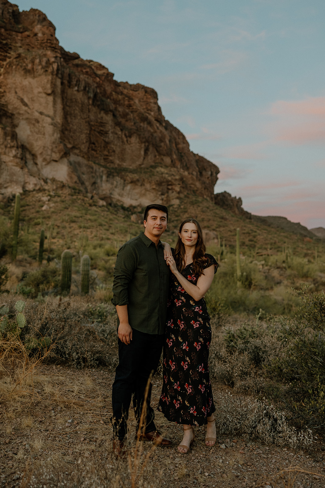 beautiful couple pose in the Arizona desert their engagement photoshoot