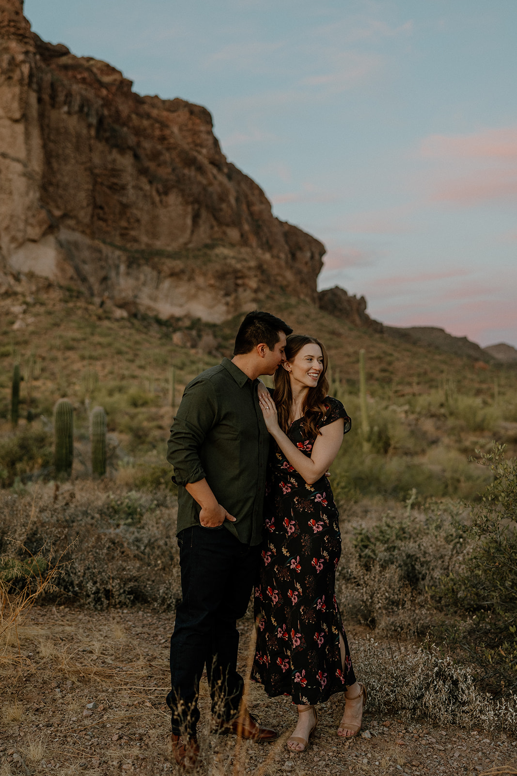 beautiful couple pose in the Arizona desert their engagement photoshoot