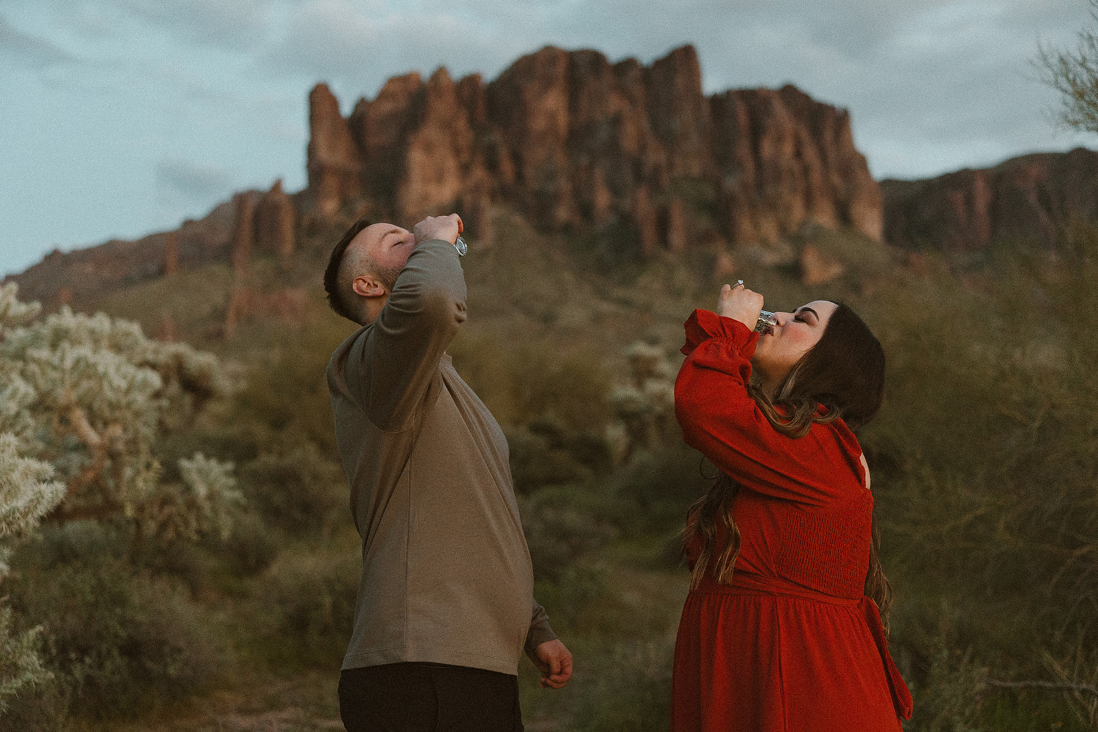 couple share a shot in the Arizona nature