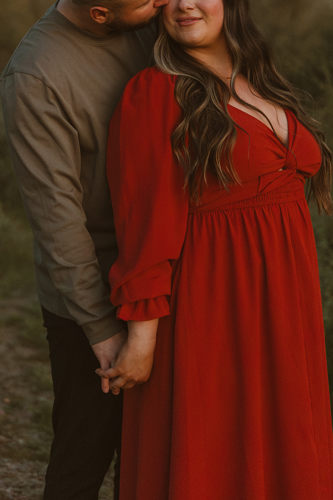 couple pose together in front of an Arizona mountain range