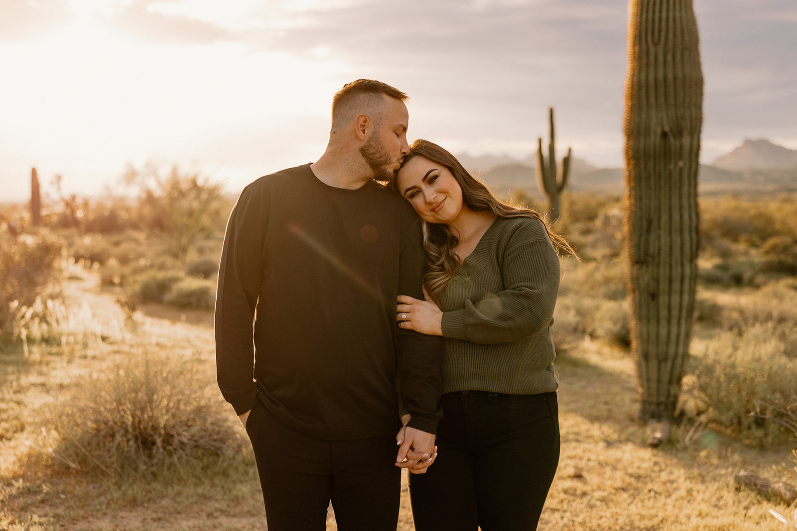 beautiful couple pose in the Arizona desert their engagement photoshoot