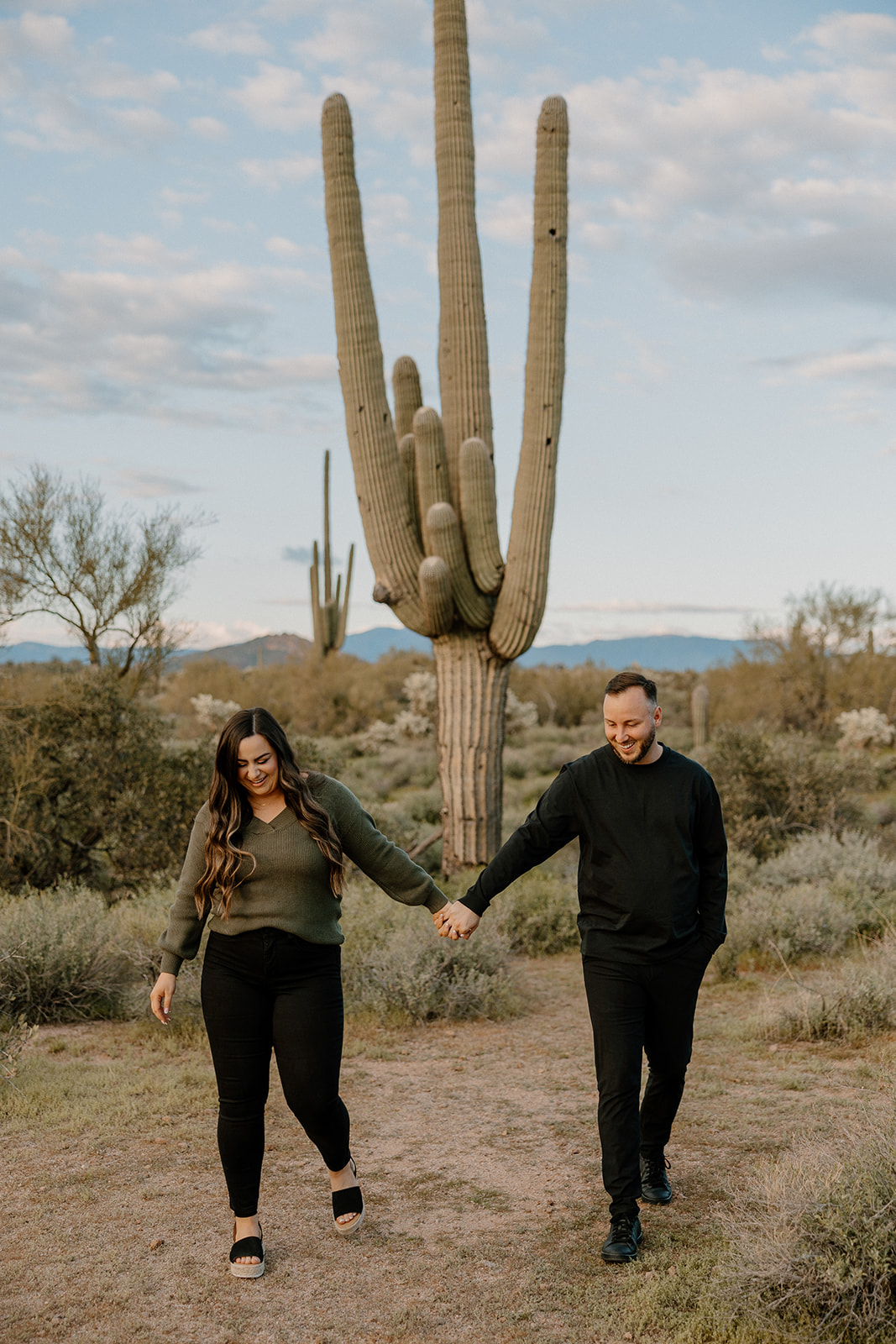 beautiful couple pose in the Arizona desert their engagement photoshoot