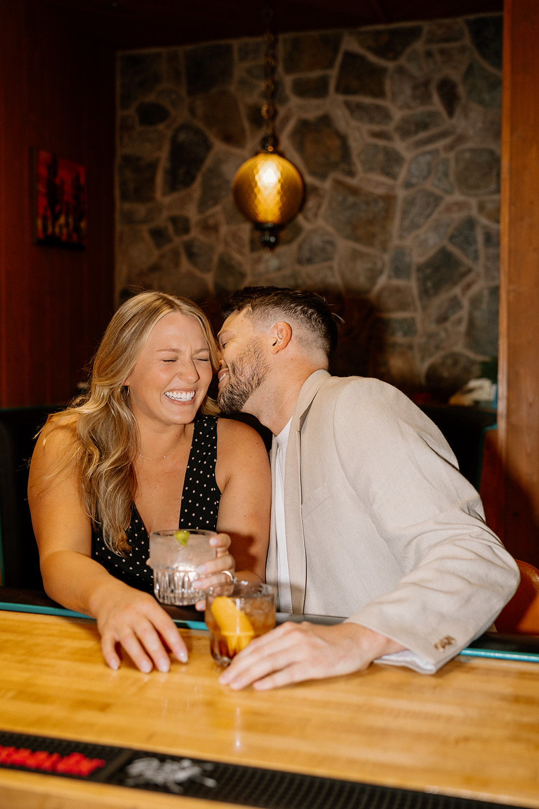 gorgeous couple takes their engagement photoshoot indoors to their favorite bar