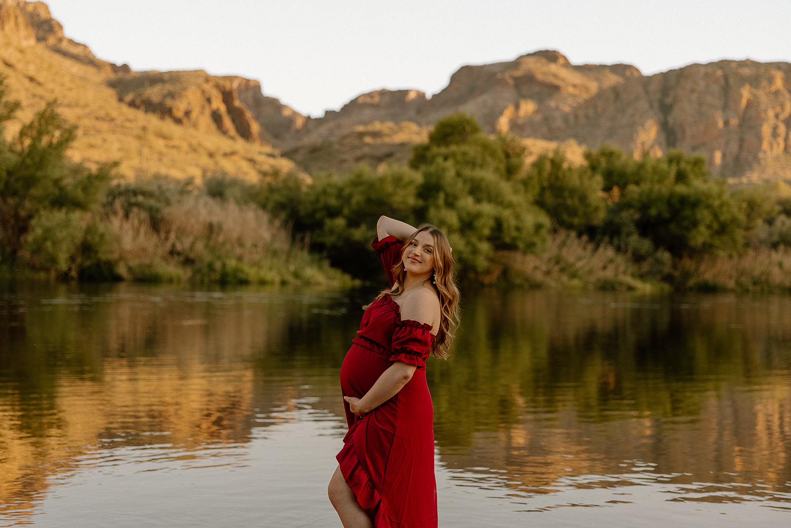 future mom poses by the water!