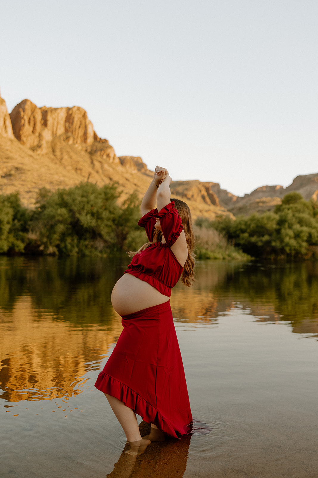 future mom poses by the water!