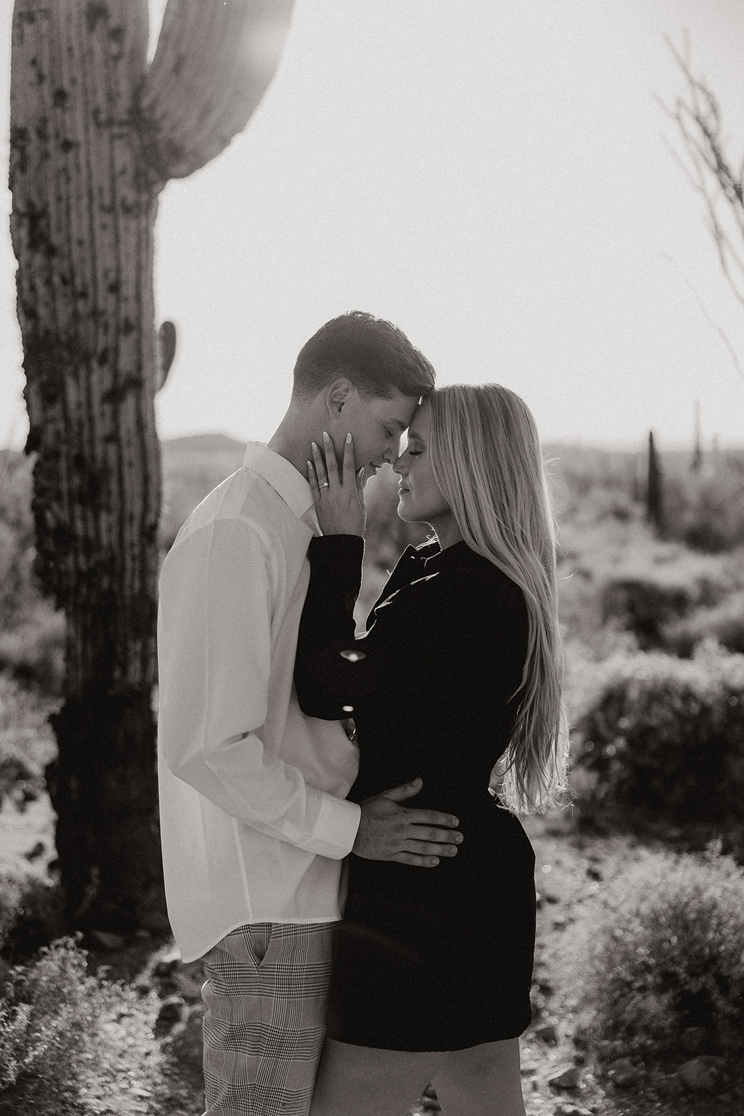 beautiful couple pose in the Arizona desert their engagement photoshoot