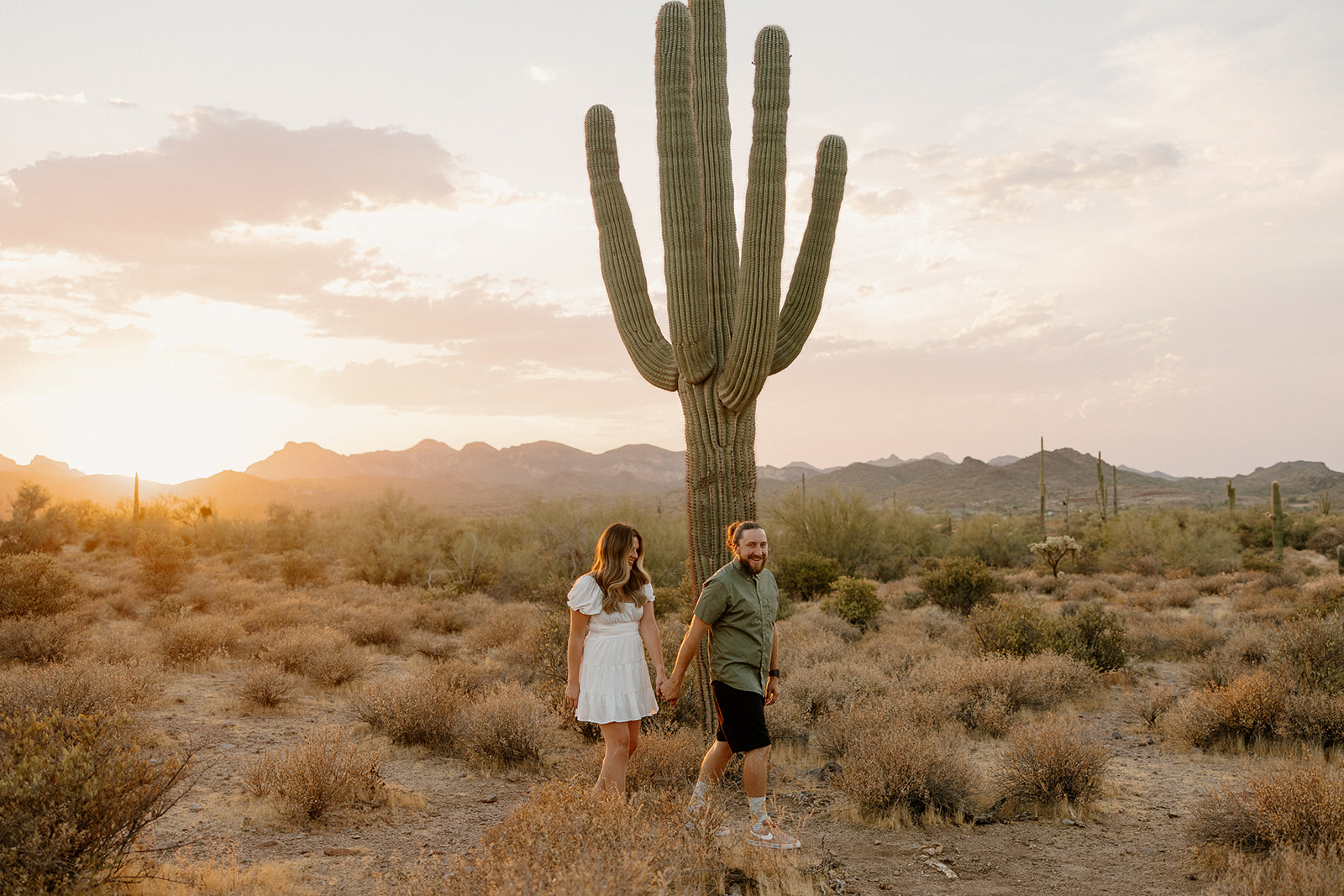 beautiful couple pose in the Arizona desert their engagement photoshoot