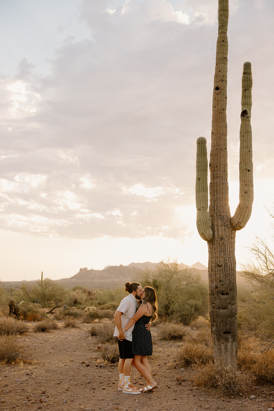 beautiful couple pose in the Arizona desert their engagement photoshoot