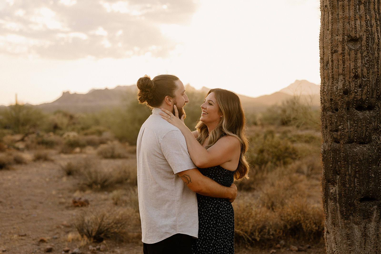 beautiful couple pose in the Arizona desert their engagement photoshoot