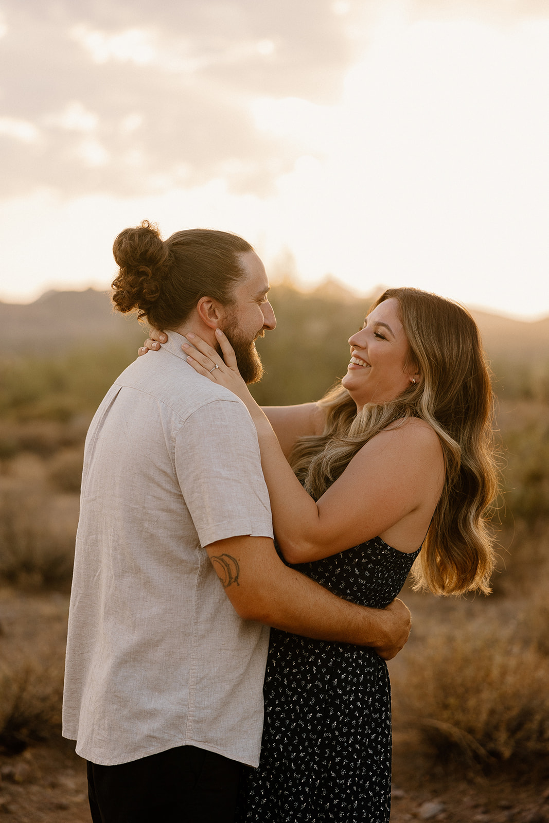 beautiful couple pose in the Arizona desert their engagement photoshoot