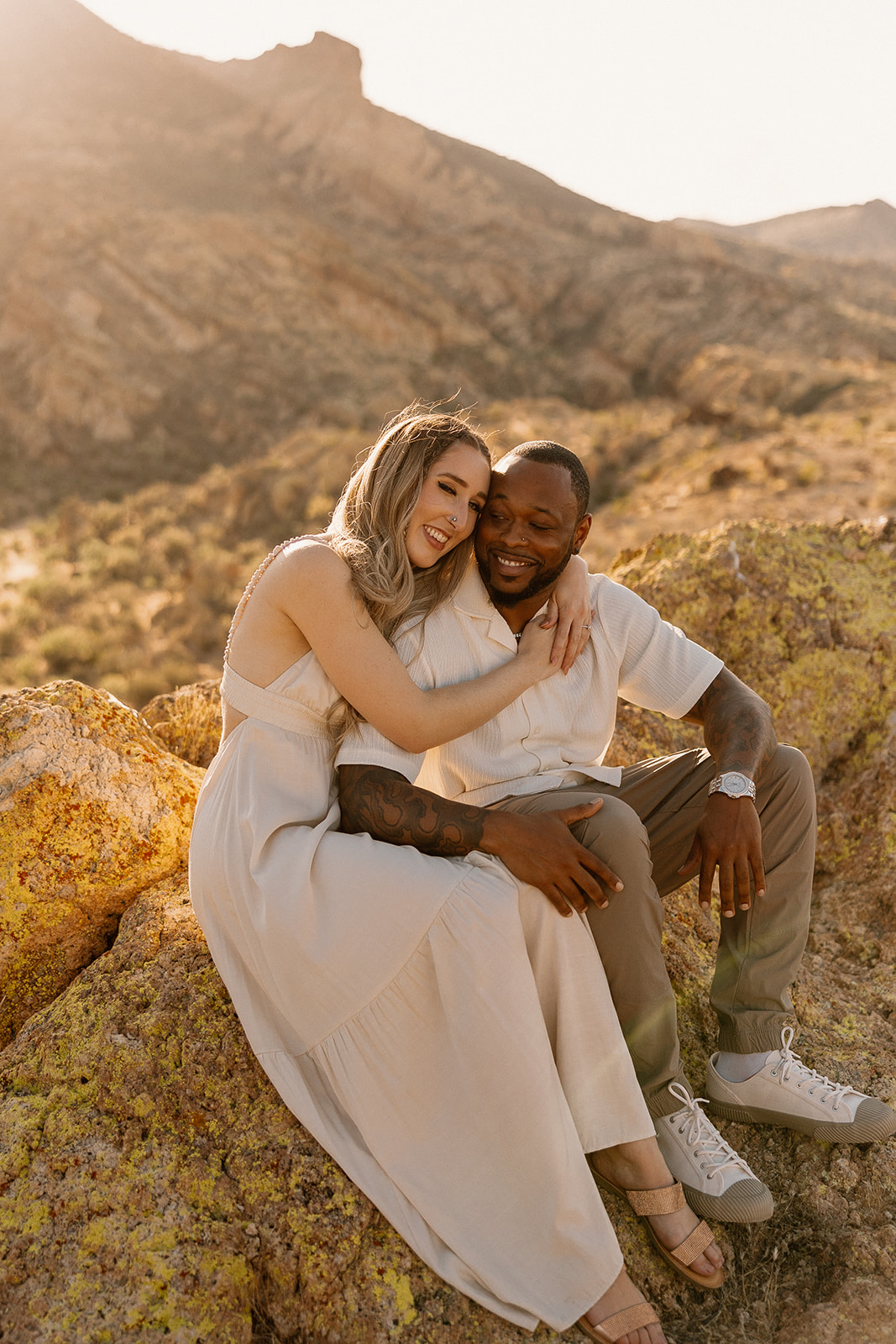 couple take photos in the Arizona mountains