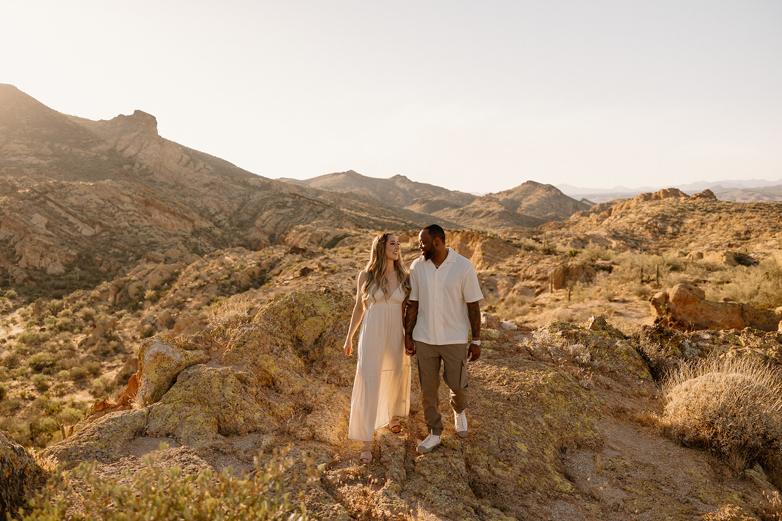 couple take photos in the Arizona mountains