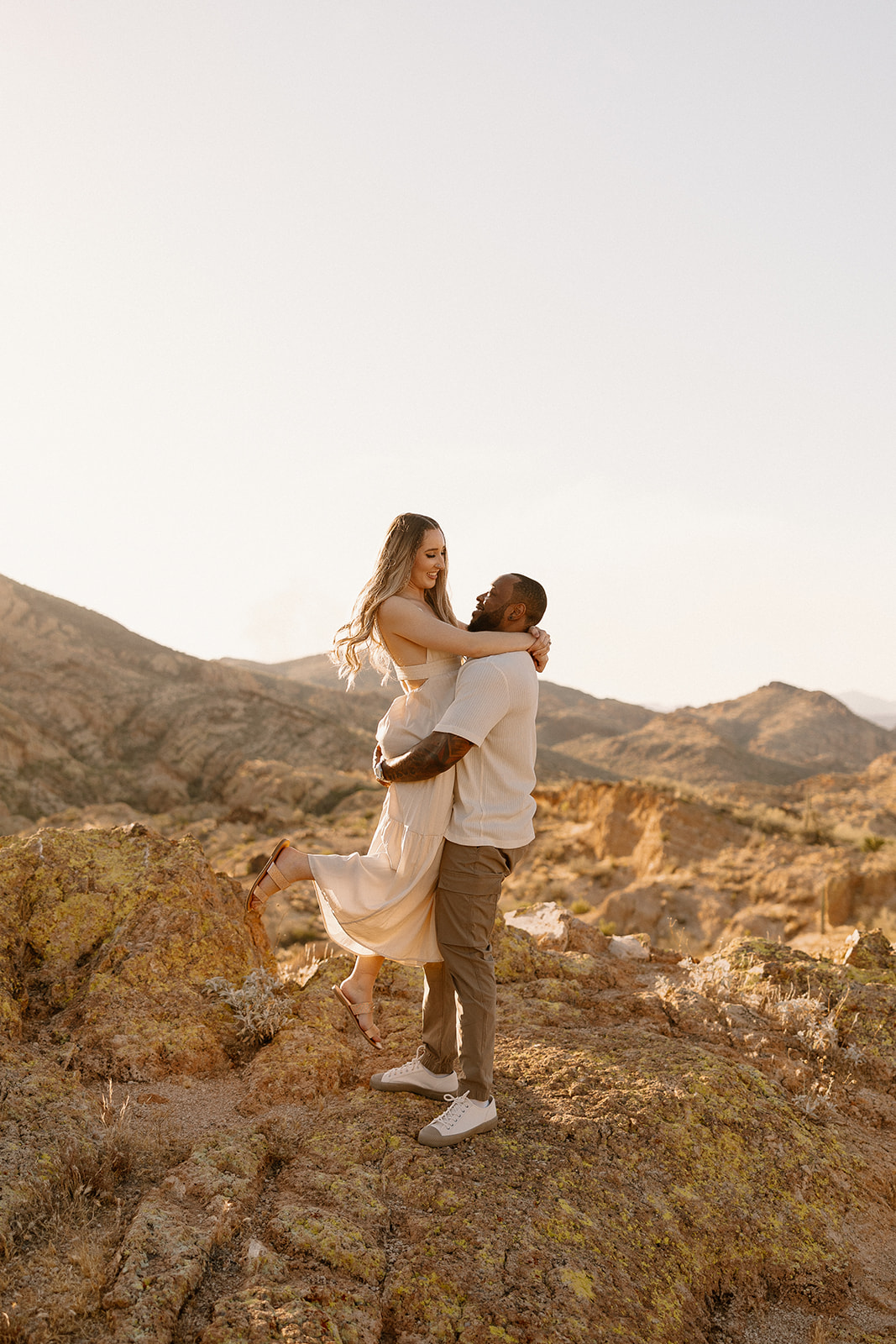 couple take photos in the Arizona mountains