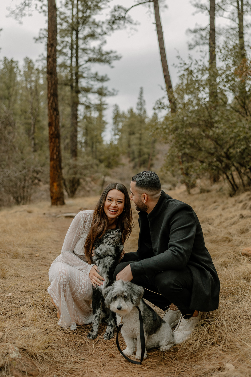 stunning couple pose with their dogs during their Arizona engagement photoshoot!