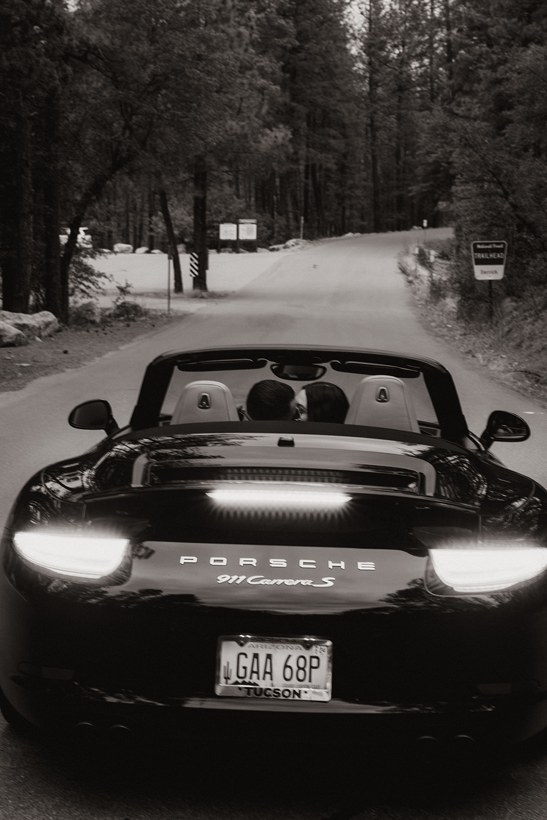 beautiful couple pose with their luxury car during their engagement photoshoot