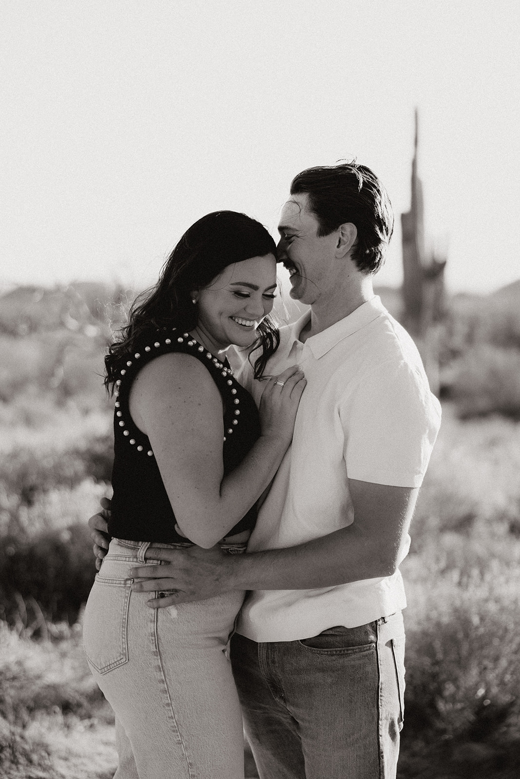 couple poses in the Arizona desert