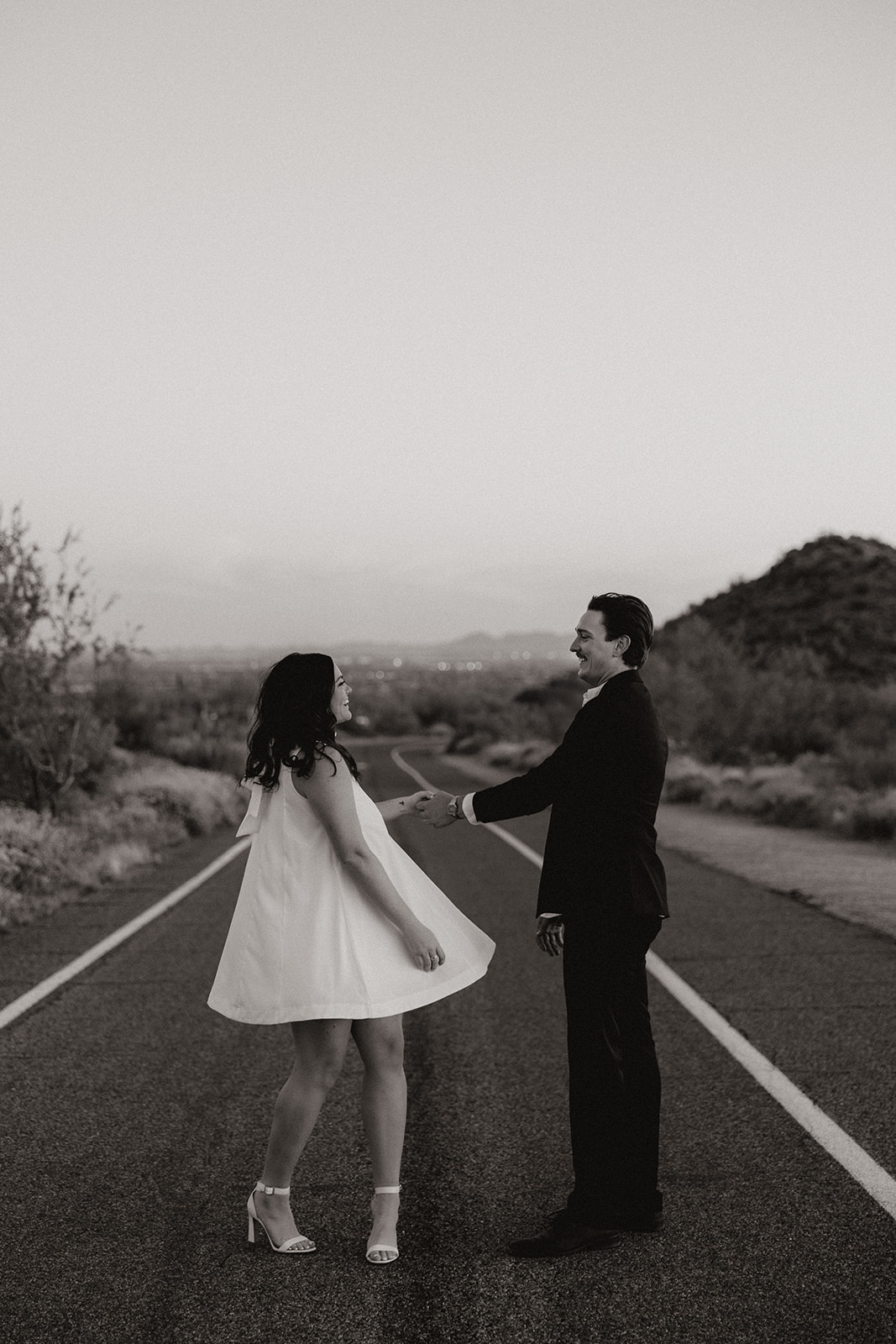 couple poses in the Arizona desert