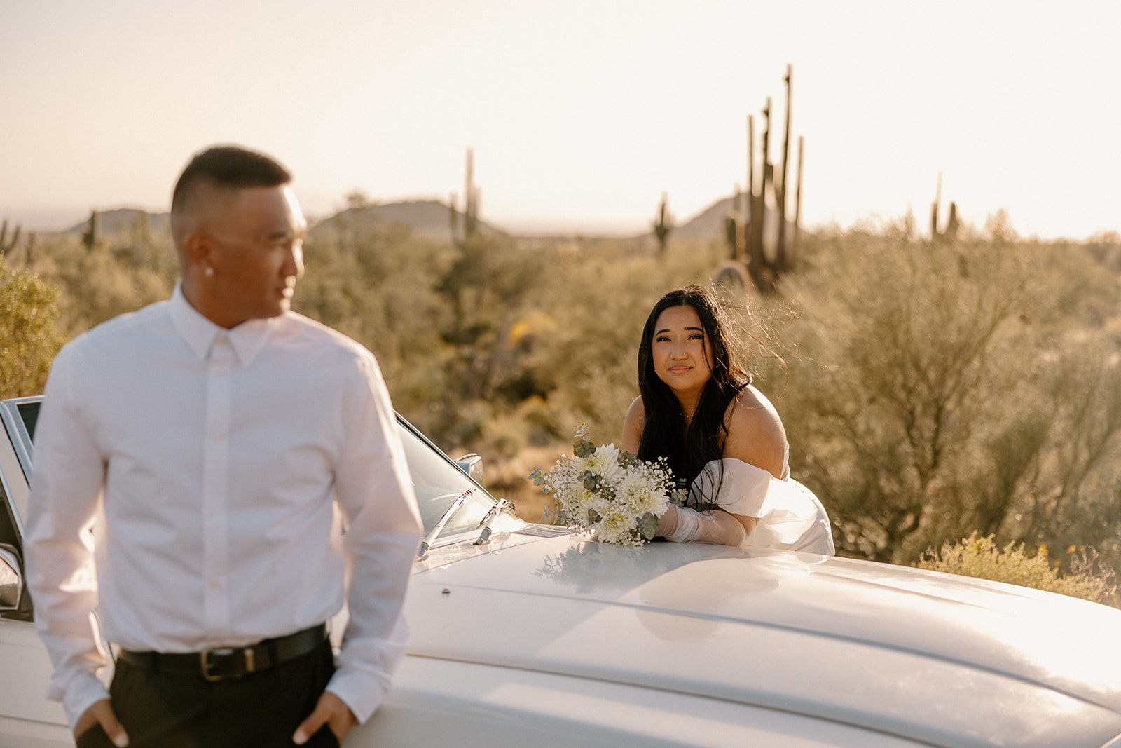 couple poses in the Arizona desert