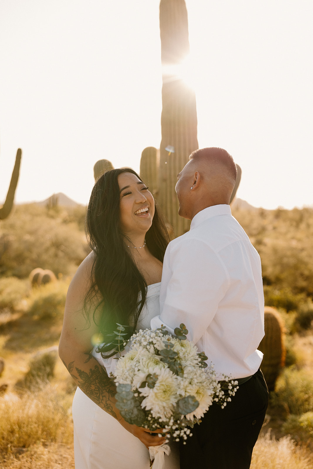 couple poses in the Arizona desert