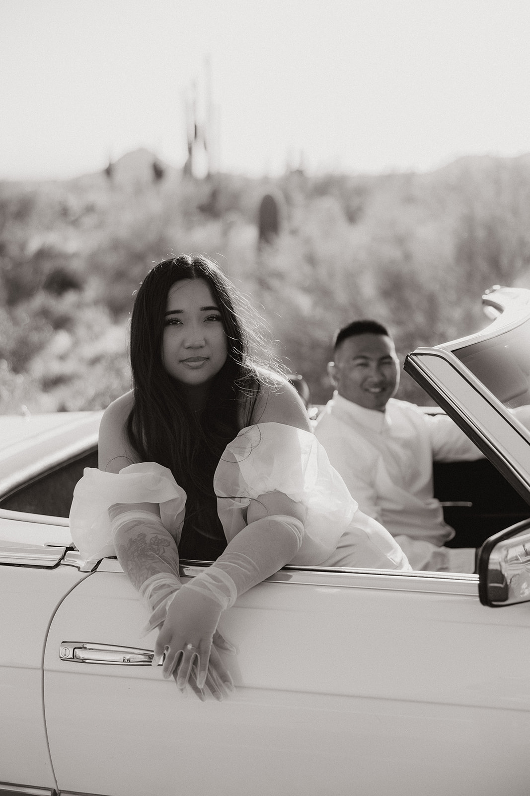 couple poses in the Arizona desert