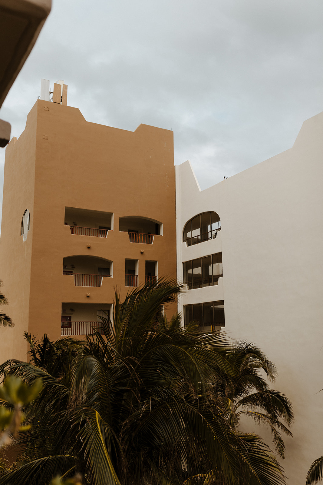 orange and white mexican building during destination wedding