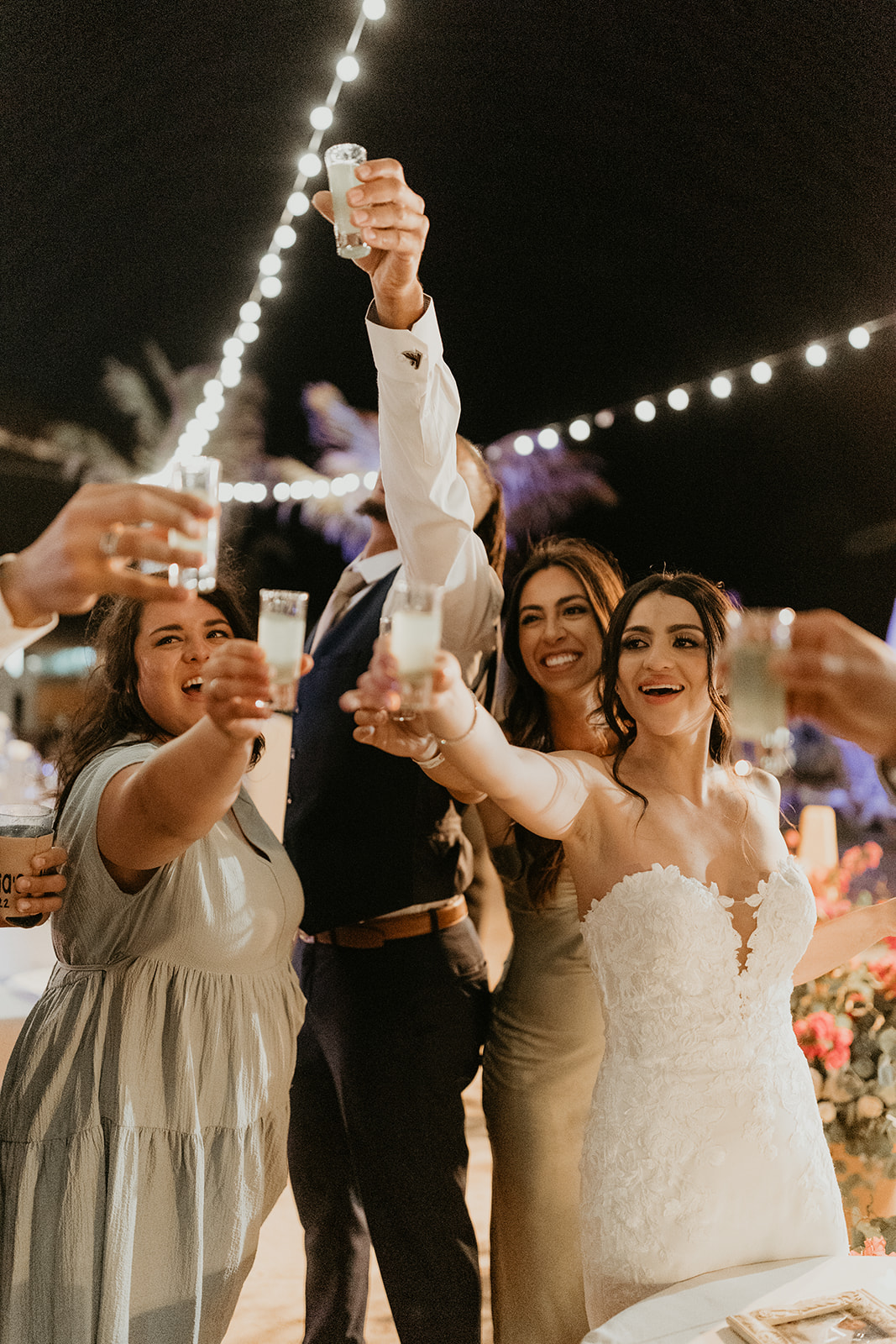 bride and groom cheers to their new adventure as a married couple during destination wedding 