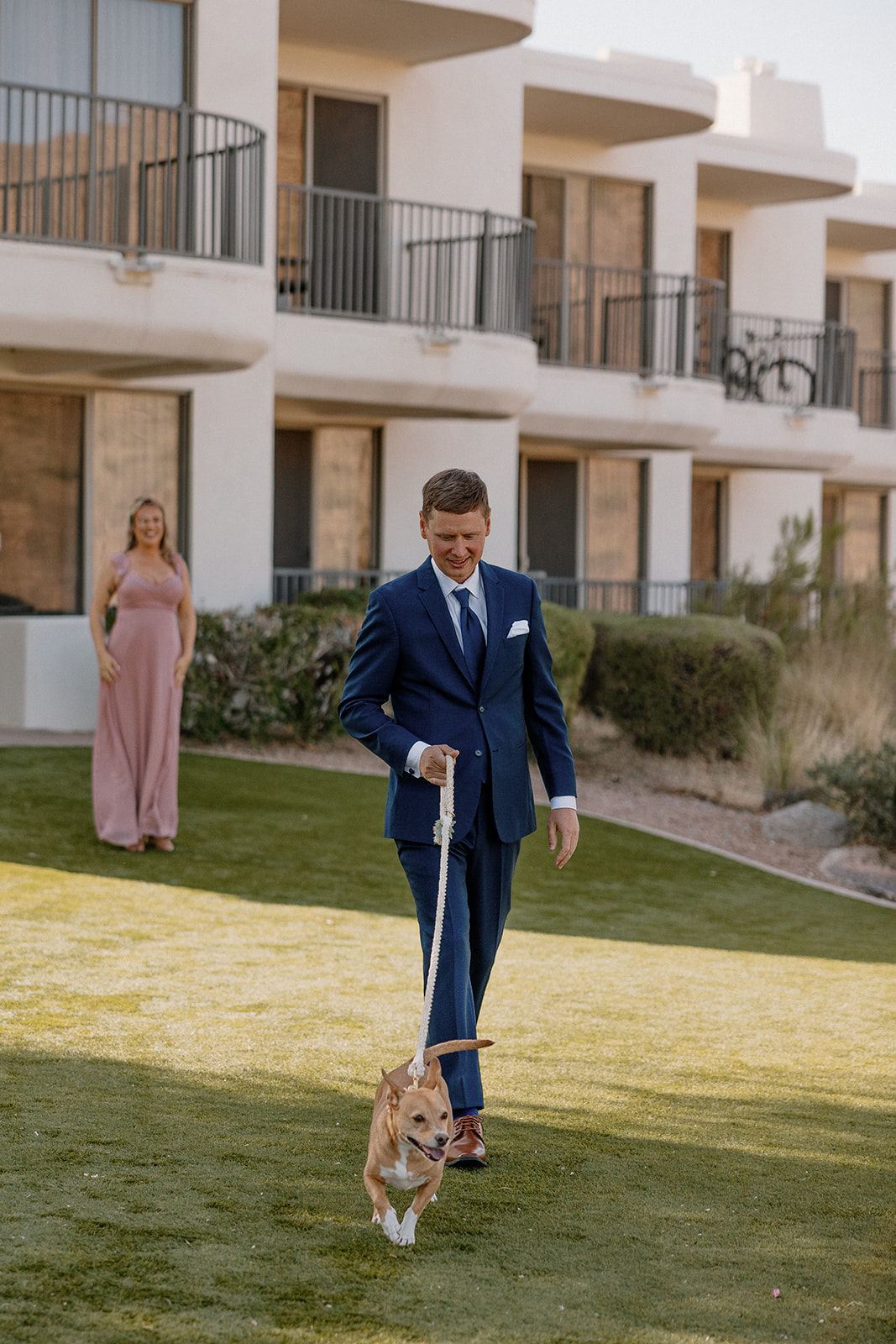 Groom poses with his dog before his Arizona wedding day