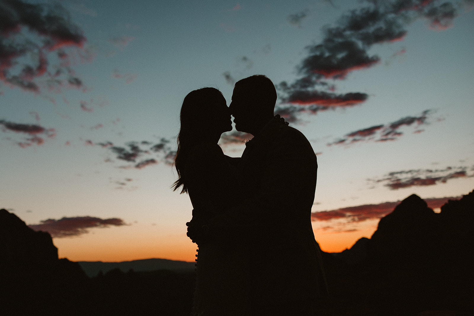 beautiful bride and groom pose together for a romantic photo in the Arizona nature