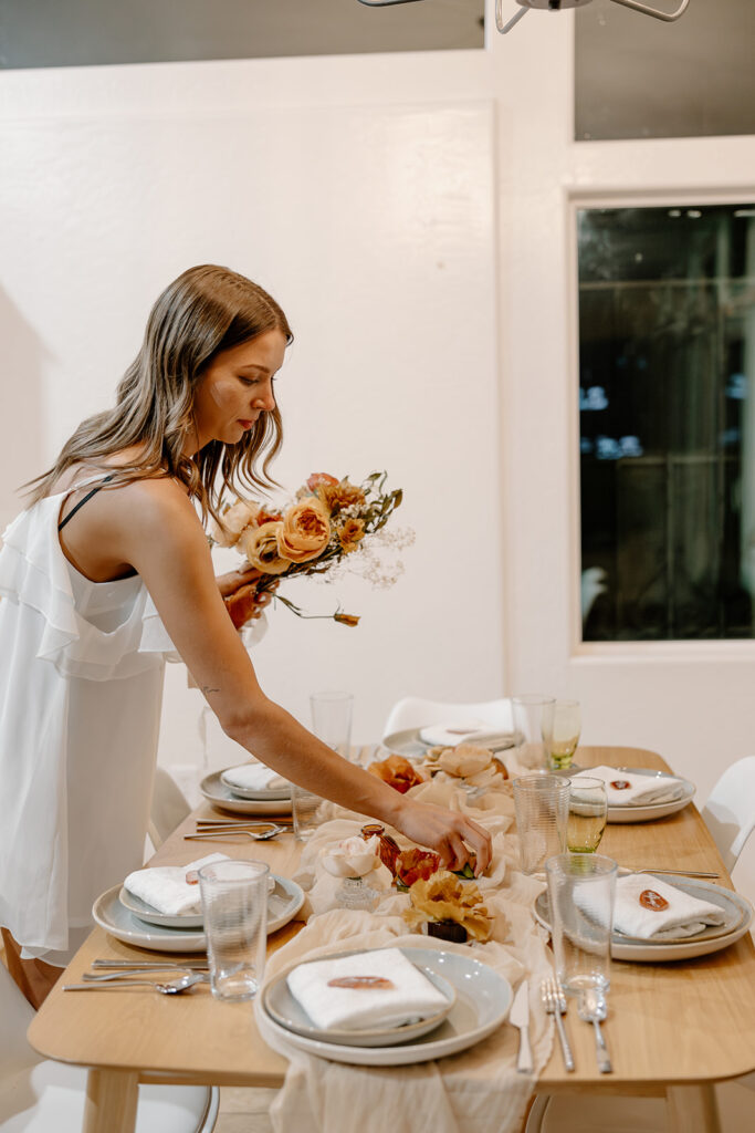 bride makes last minute adjustments before her wedding day gets started