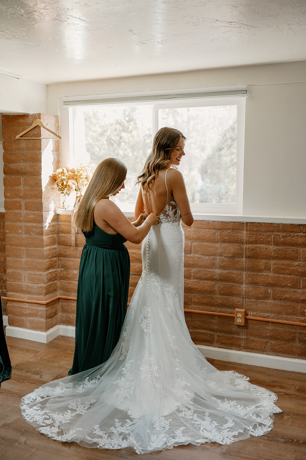 bride gets help finalizing her dress prep as her wedding day timeline ramps up!