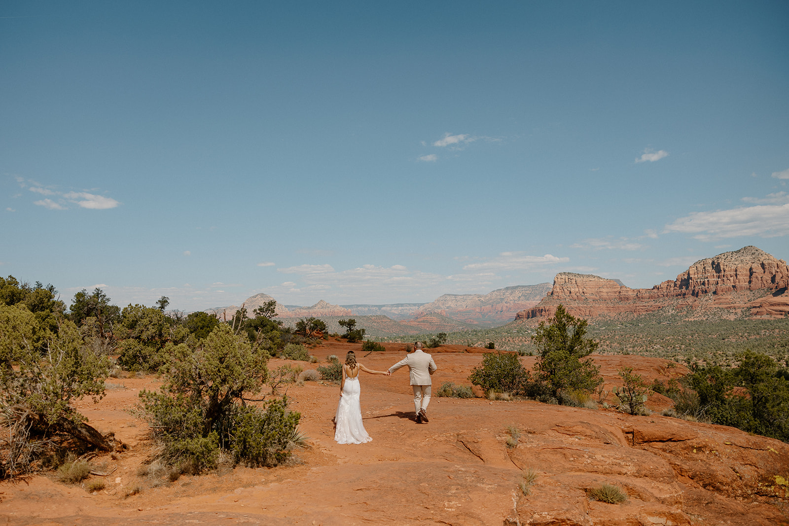 beautiful bride and groom pose together for a romantic photo in the Arizona nature