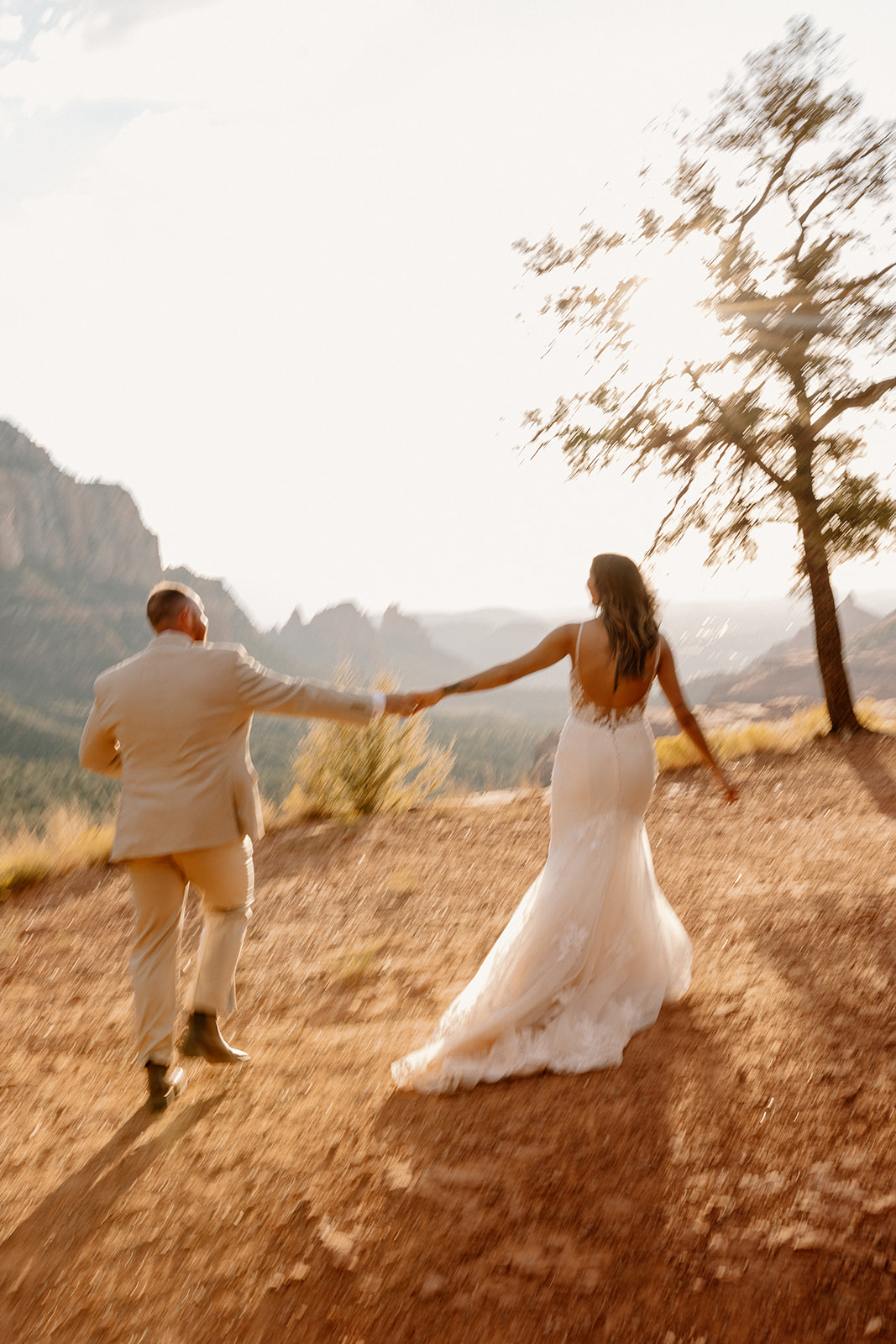 beautiful bride and groom pose together for a romantic photo in the Arizona nature