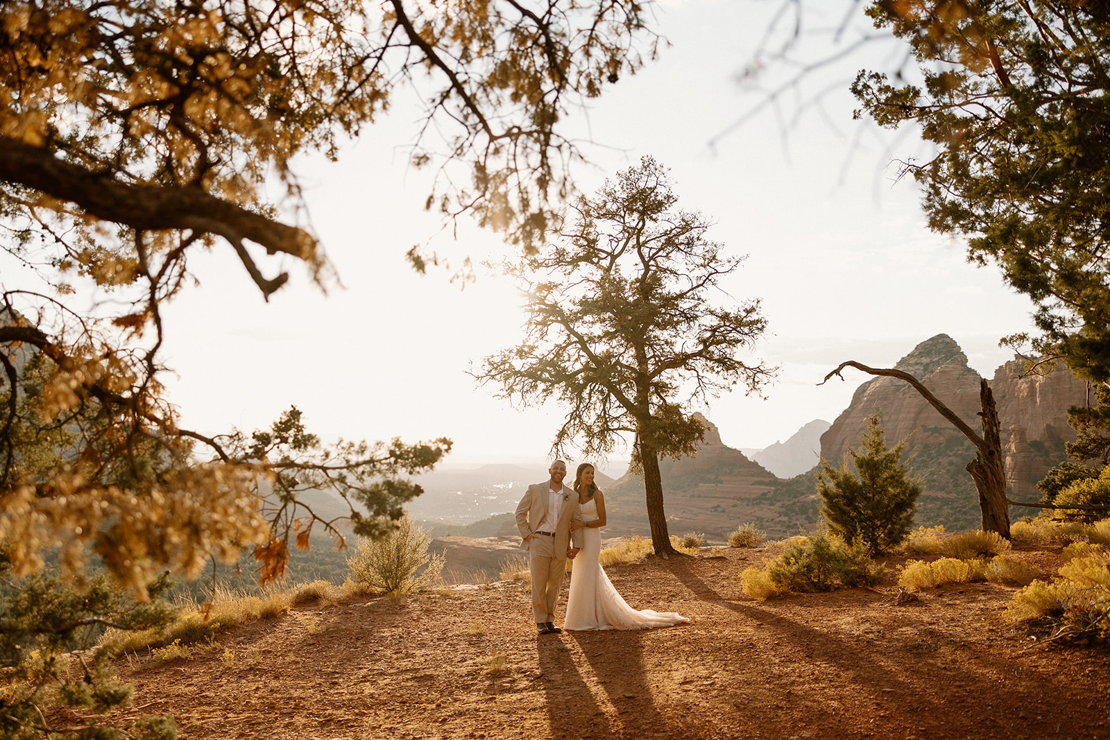 stunning bride and groom pose together for a romantic photo in the Arizona nature