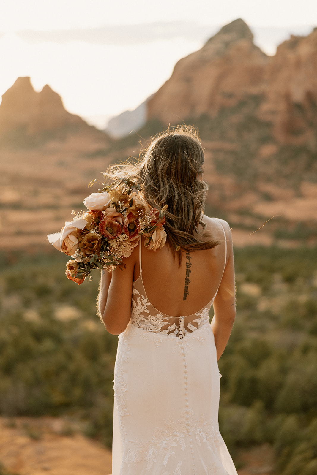 bride poses for a photo in the Arizona Nature perfect to pencil i to your Elopement day timeline!