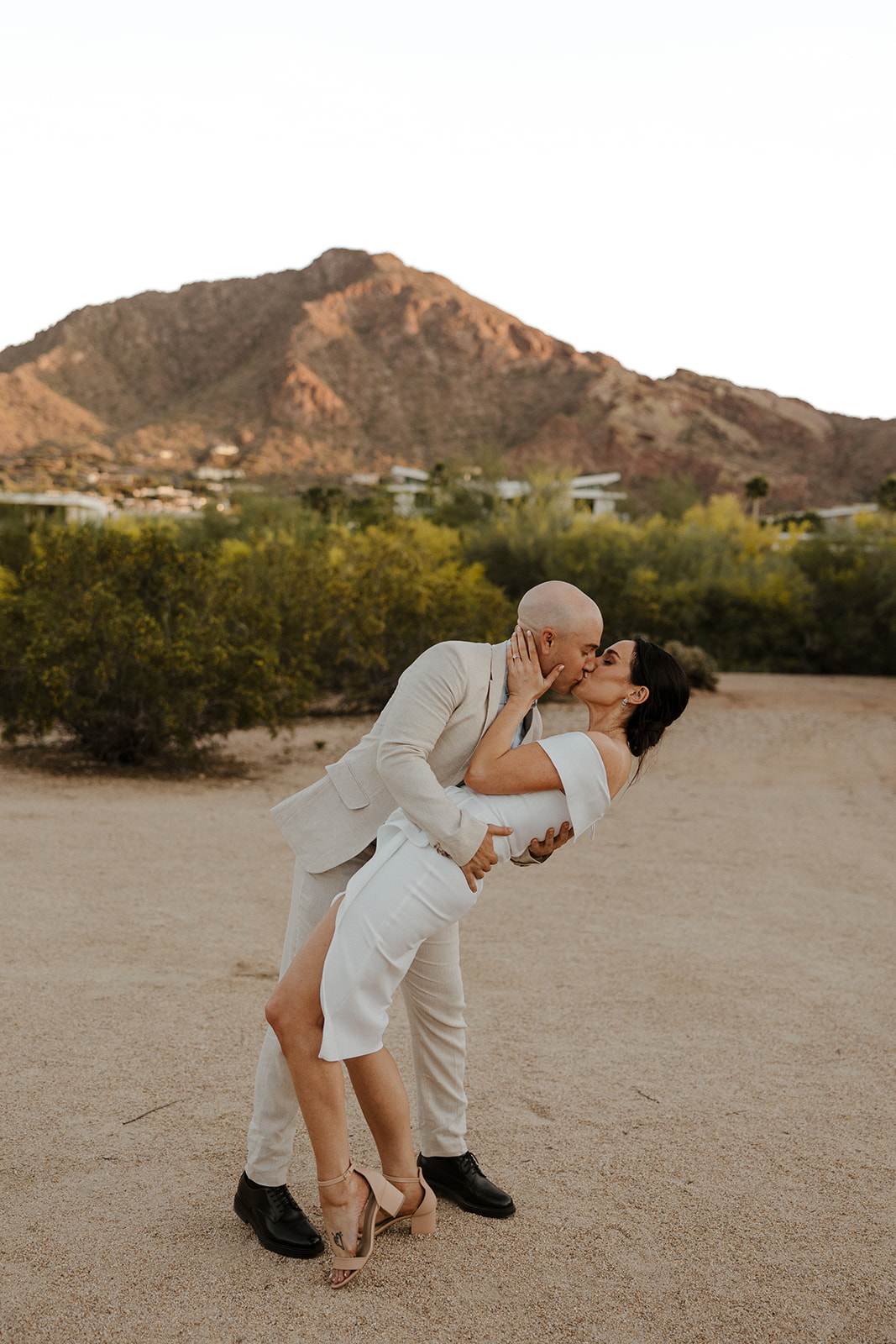 bride and groom share an intimate moment together during their wedding day rehearsal