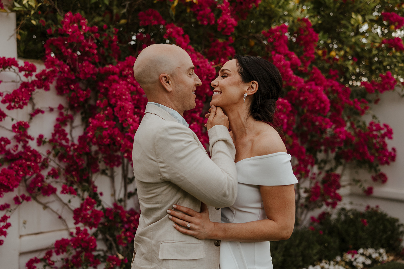 bride and groom share an intimate moment together during their wedding day rehearsal