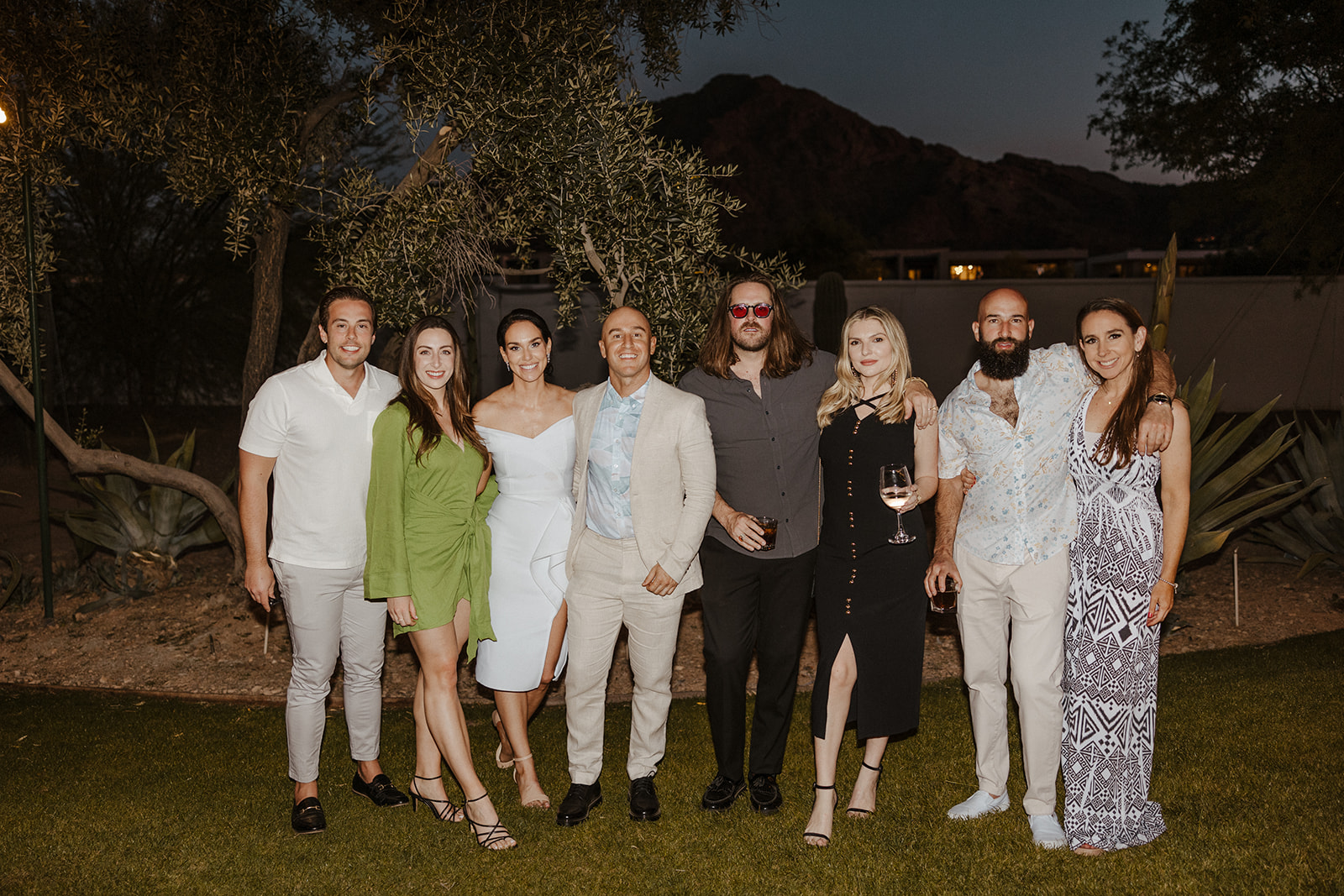 bride and groom pose with guests