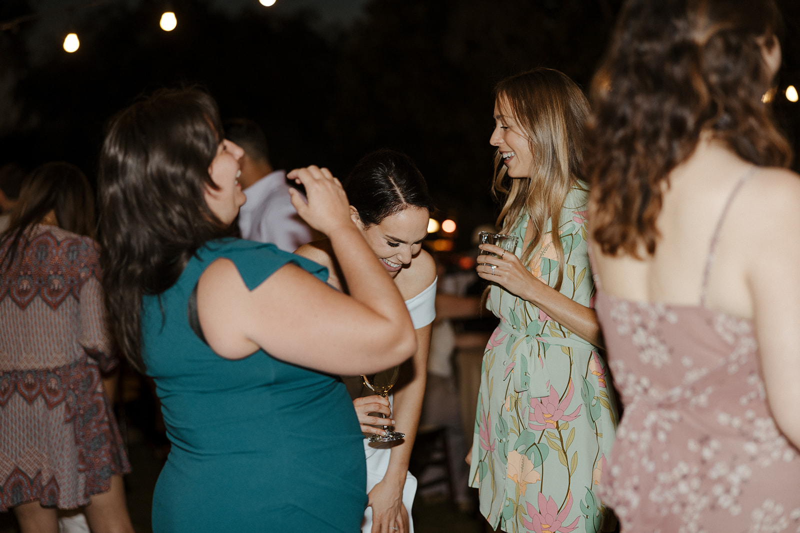 bride shares laughs with guests 