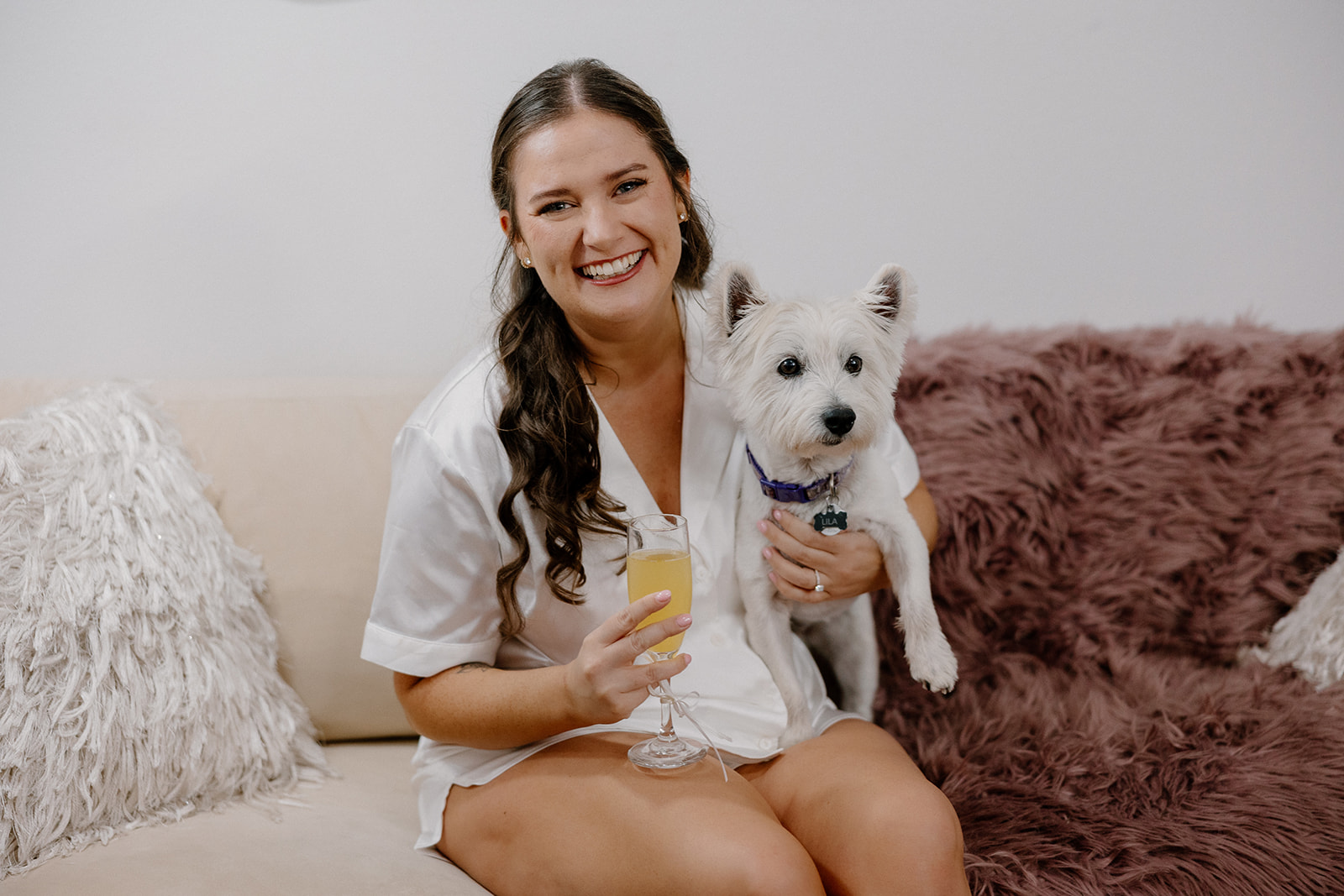 bride poses with her dog before her elegant Arizona wedding day