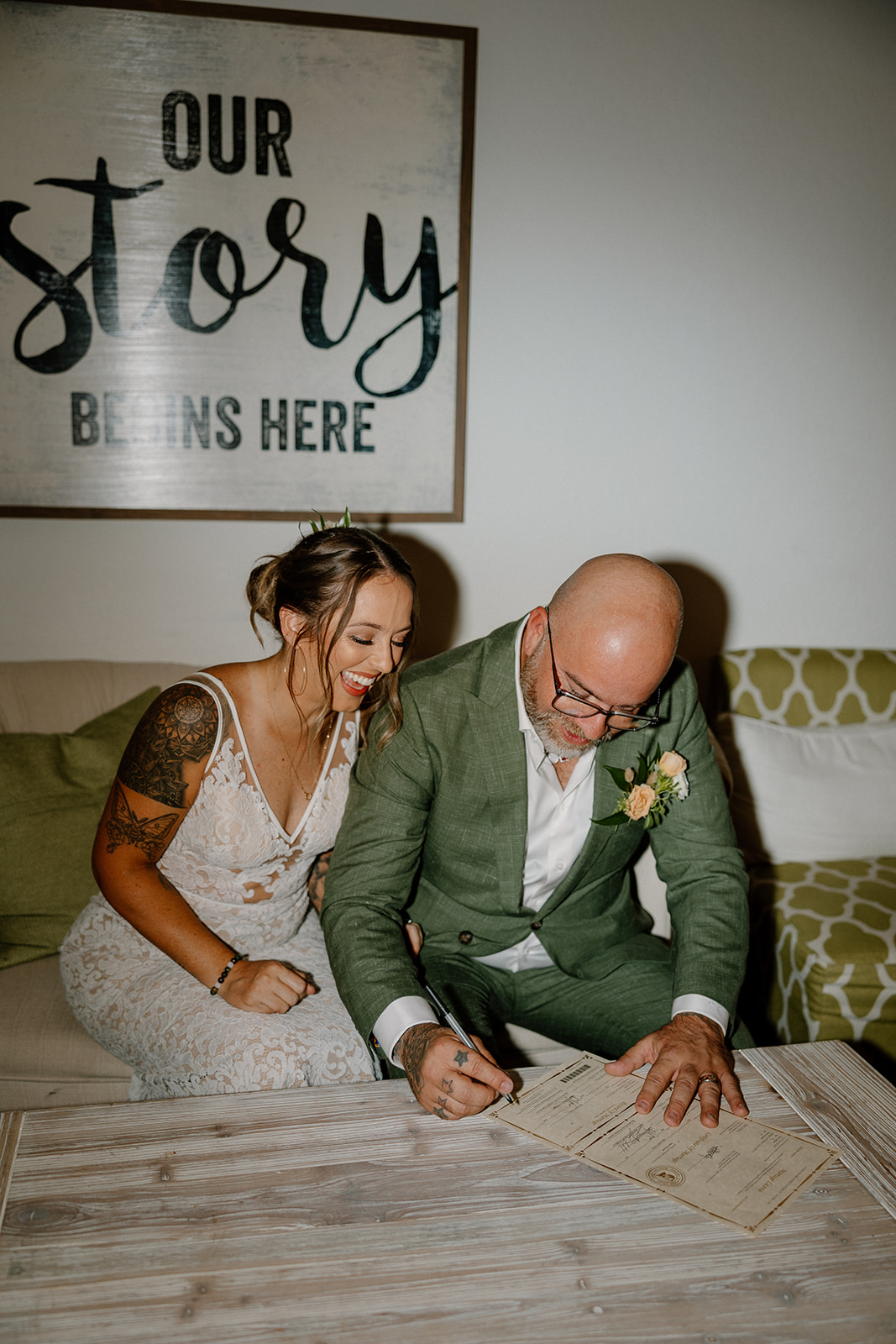 bride and groom sign their marriage license to complete their Arizona wedding day