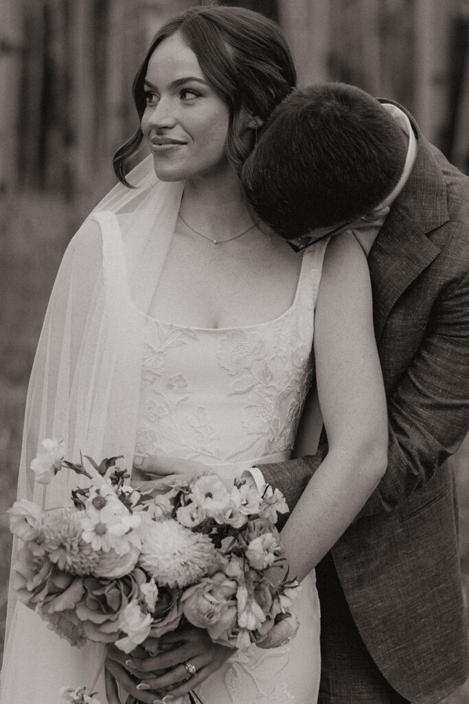stunning bride and groom pose for photos together after their stunning Fall Flagstaff Arizona wedding day