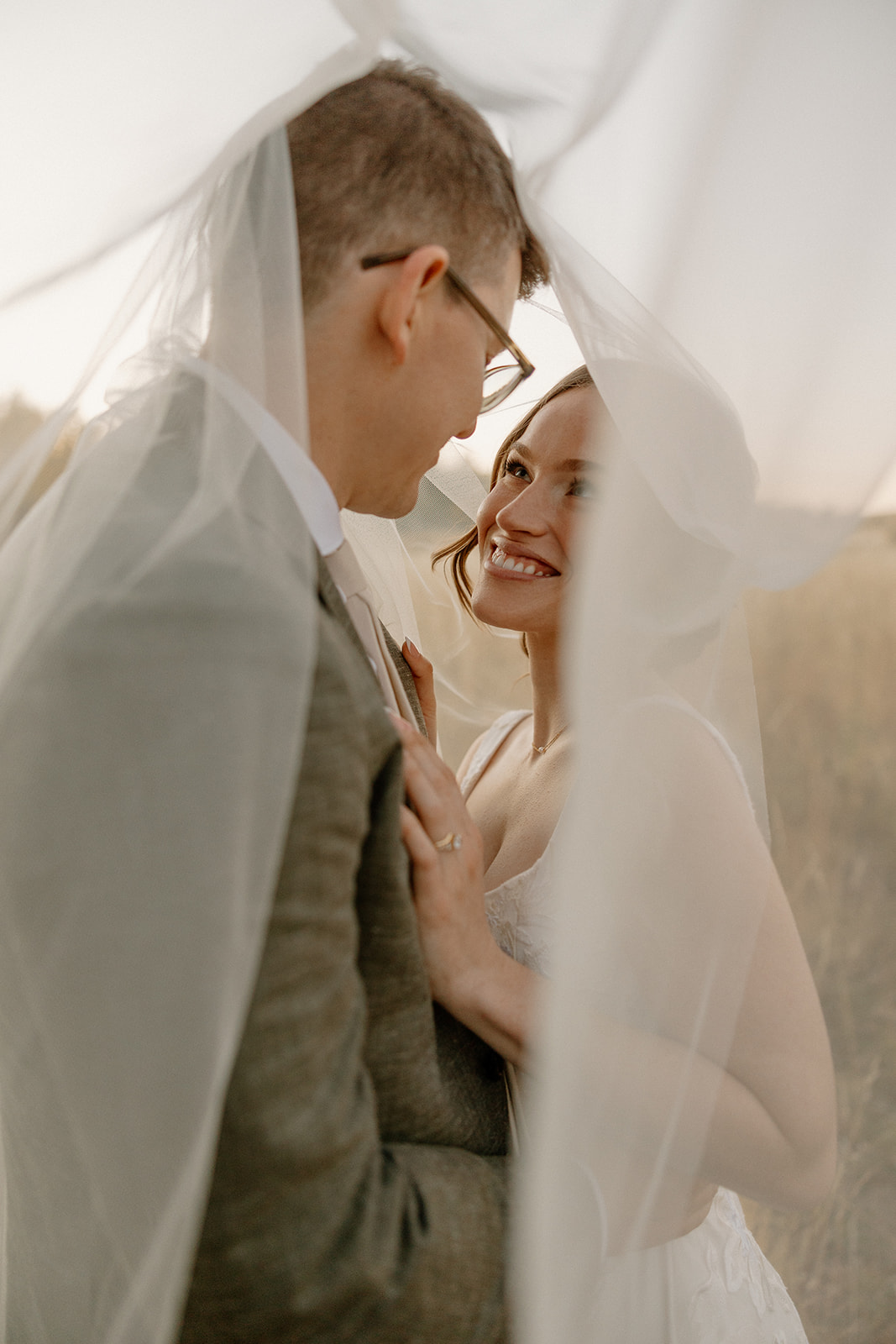 stunning bride and groom pose for photos together after their stunning Fall Flagstaff Arizona wedding day