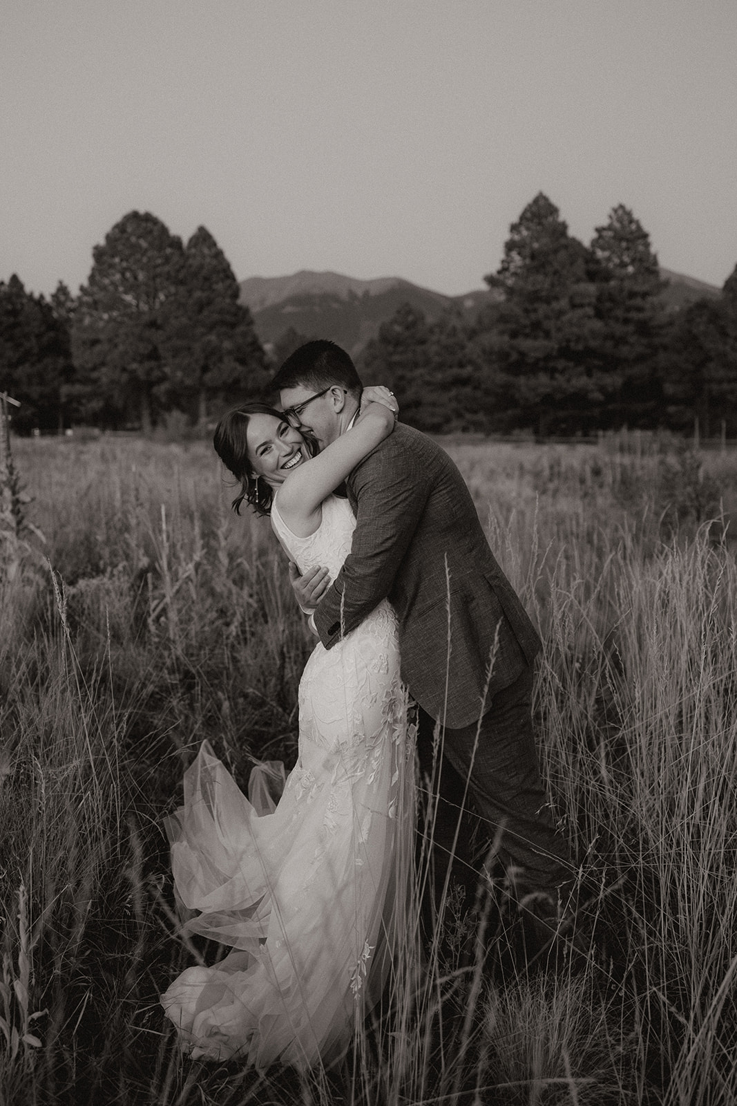 stunning bride and groom pose for photos together after their stunning Fall Flagstaff Arizona wedding day