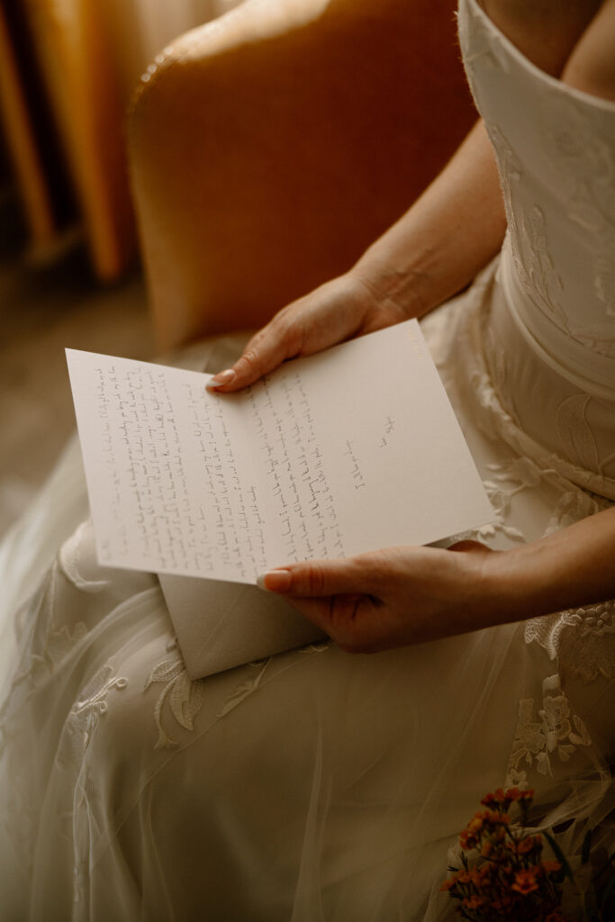 bride reads private vows from her husband before their Arizona wedding day