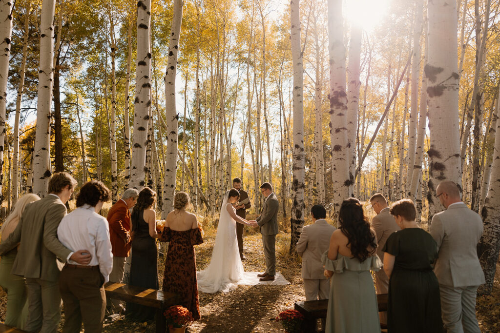 beautiful Fall Flagstaff wedding ceremony hidden in the trees