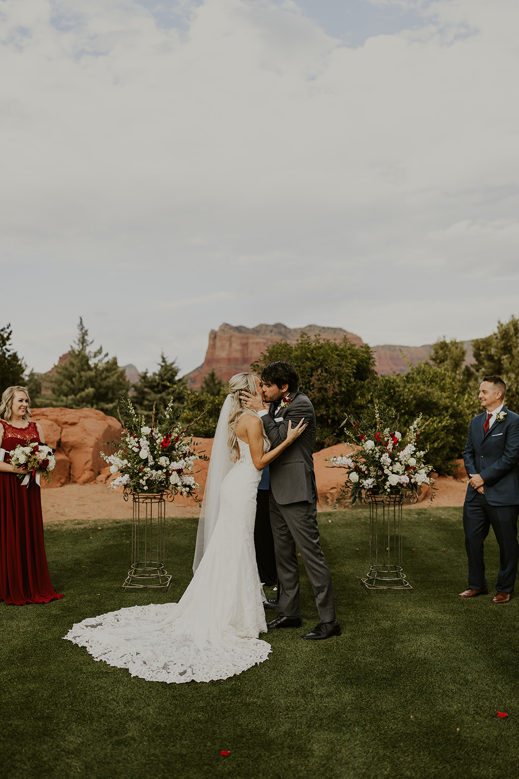 newly married couple kissing at altar at Sedona Golf Resort